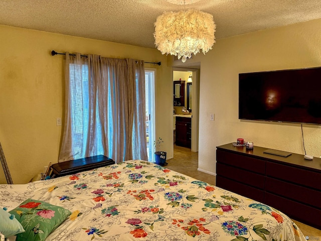 tiled bedroom featuring an inviting chandelier and a textured ceiling