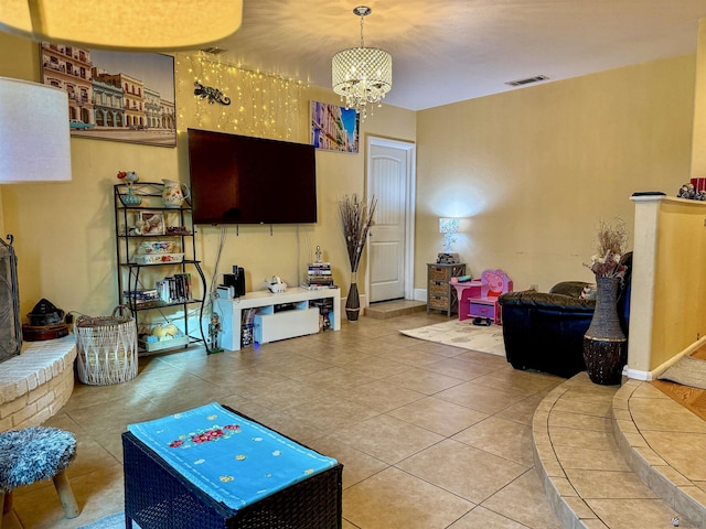 playroom with tile patterned flooring and a chandelier