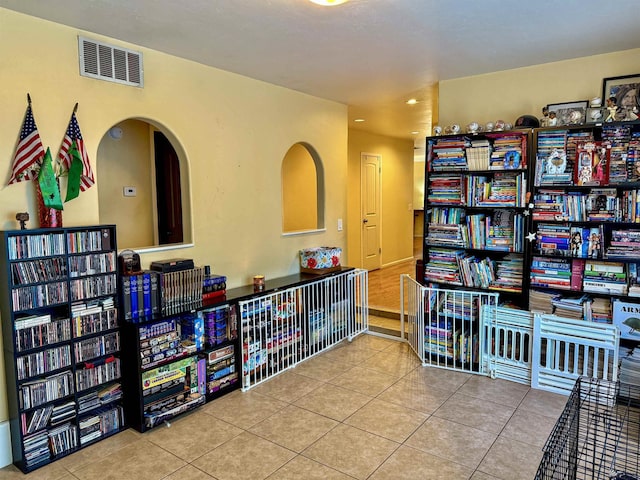 recreation room with tile patterned flooring