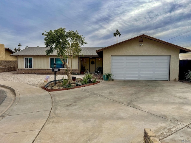 ranch-style house featuring a garage