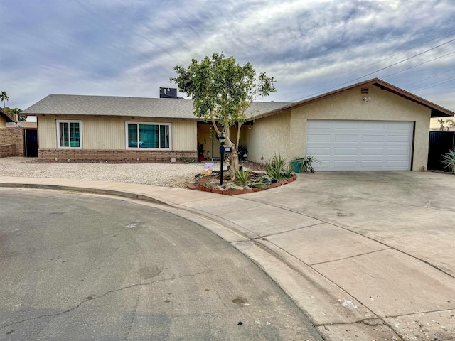 single story home featuring a garage