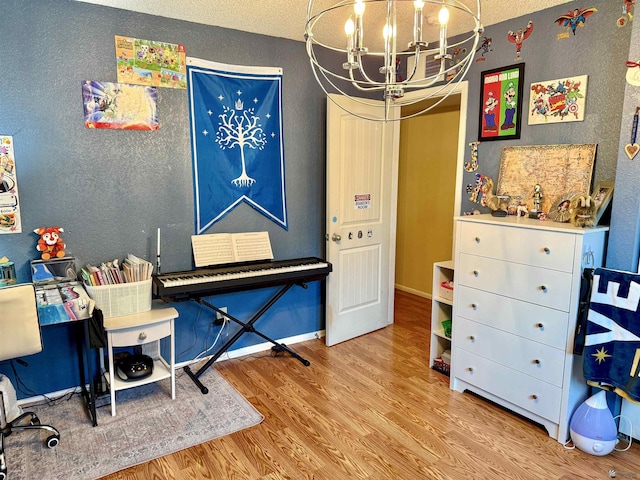 interior space with an inviting chandelier and light wood-type flooring