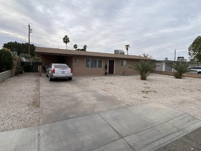 view of front facade with a carport