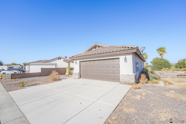 view of side of property featuring a garage