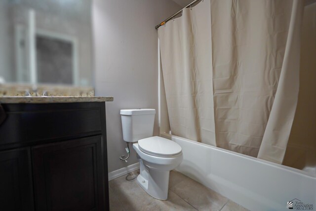 bathroom with tile patterned floors, toilet, and shower / bath combo