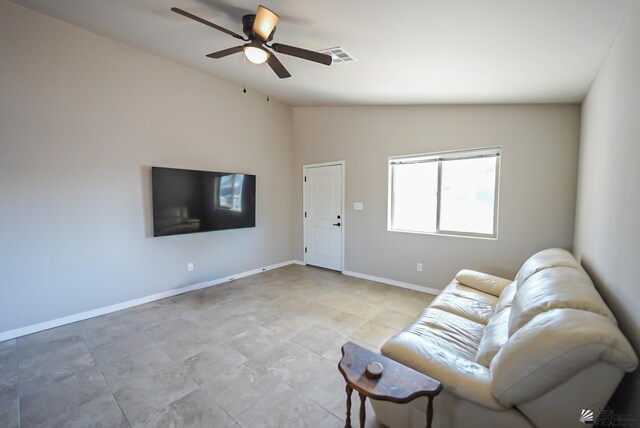 unfurnished living room with ceiling fan and vaulted ceiling