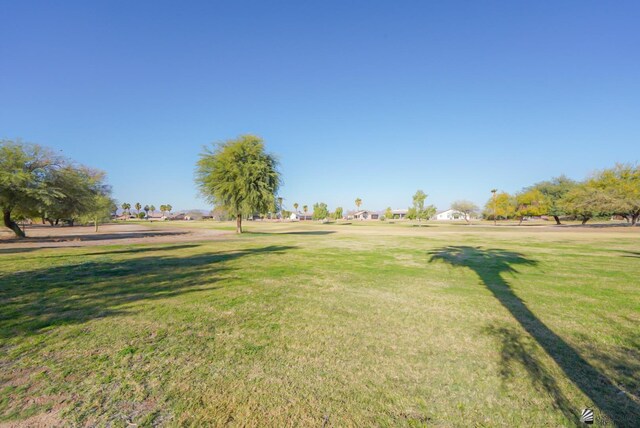 view of property's community with a lawn