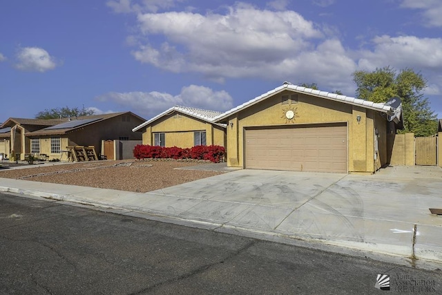 ranch-style home featuring a garage