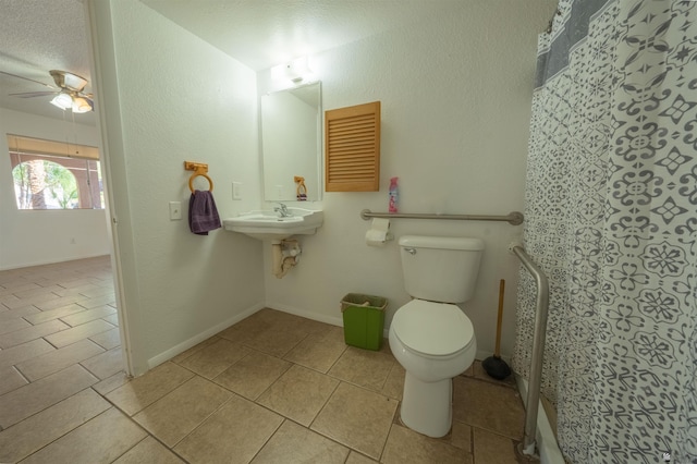 bathroom featuring tile patterned floors, a textured ceiling, toilet, and ceiling fan