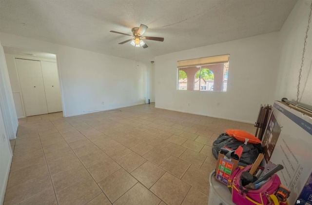 unfurnished room with ceiling fan