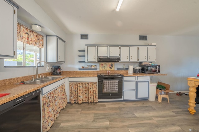 kitchen with sink, white cabinets, black appliances, and range hood