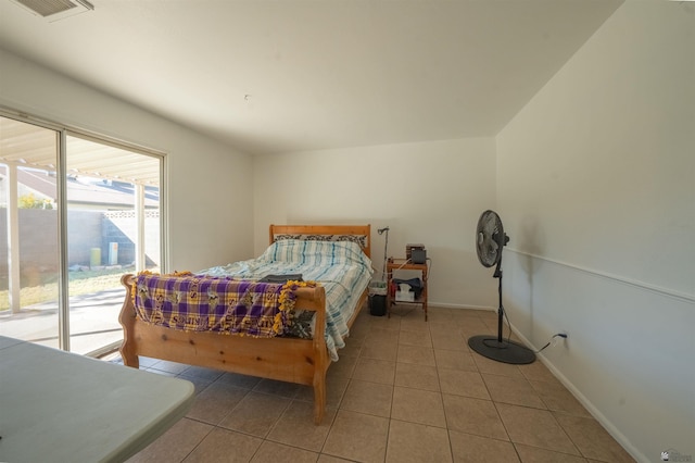 bedroom with tile patterned flooring and access to exterior