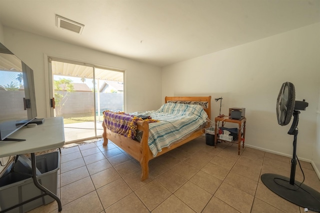 tiled bedroom featuring access to outside