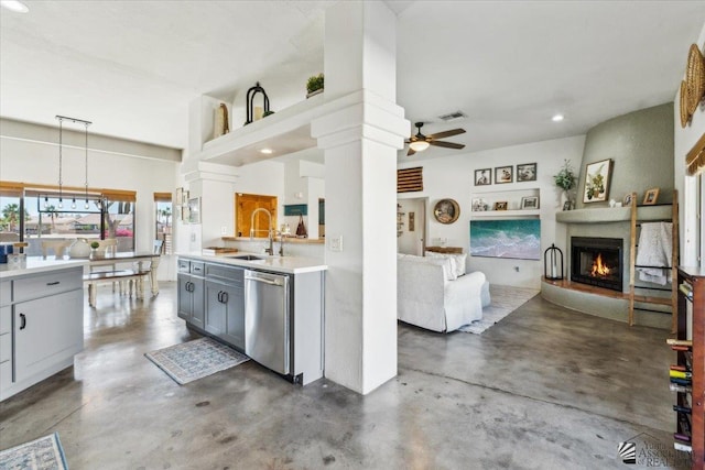 kitchen featuring visible vents, a sink, finished concrete flooring, and stainless steel dishwasher