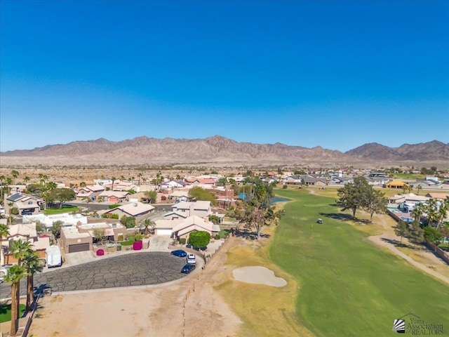 birds eye view of property with a mountain view, golf course view, and a residential view