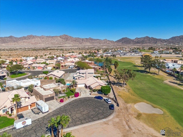 aerial view with a residential view, view of golf course, and a mountain view