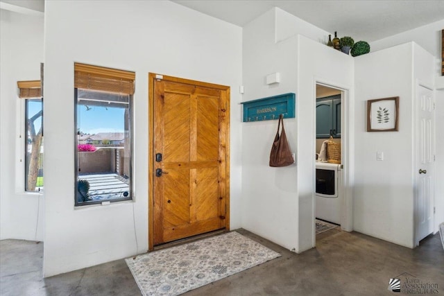 entrance foyer featuring concrete flooring