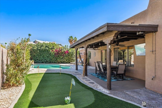 view of patio with a fenced backyard and a ceiling fan