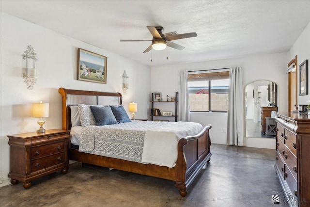 bedroom featuring ceiling fan, a textured ceiling, arched walkways, and concrete flooring