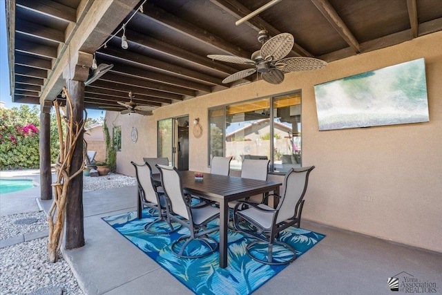 view of patio with a ceiling fan and outdoor dining space