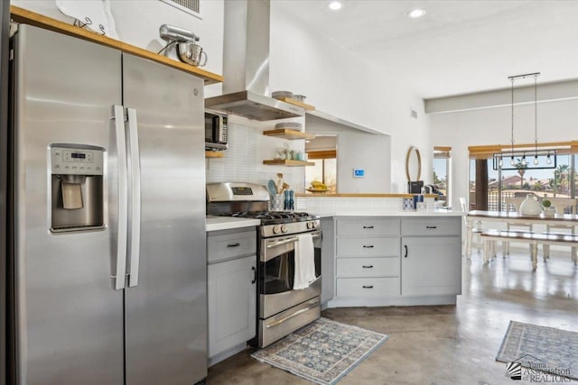 kitchen with island exhaust hood, appliances with stainless steel finishes, gray cabinets, and a wealth of natural light