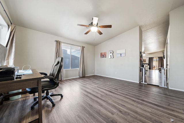 office area featuring lofted ceiling, dark wood-style floors, baseboards, and a ceiling fan