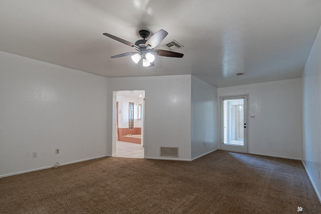 unfurnished room with light colored carpet and ceiling fan