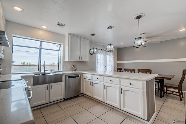 kitchen with dishwasher, pendant lighting, white cabinets, and kitchen peninsula