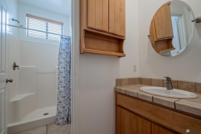 bathroom with vanity and walk in shower