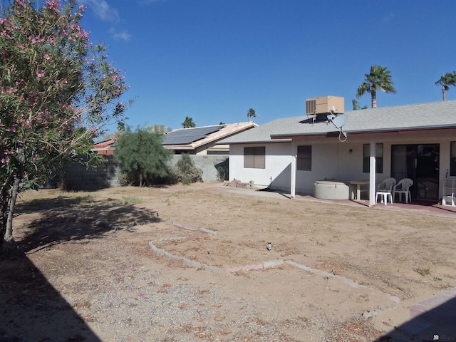 view of yard featuring a patio area, fence, and central air condition unit