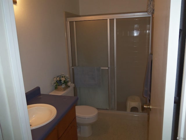 full bathroom with toilet, a shower stall, and vanity