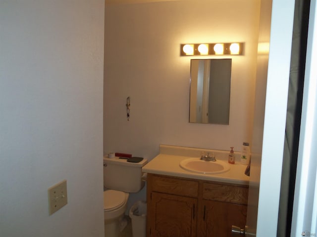 bathroom with toilet and vanity