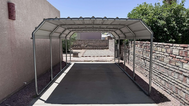 view of parking / parking lot featuring a carport