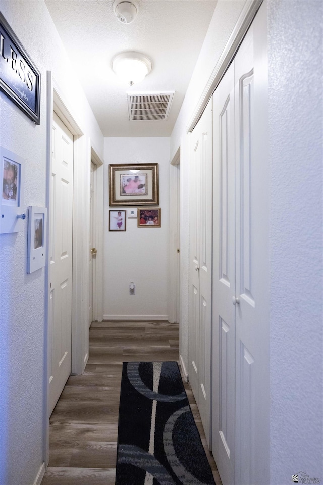 hallway featuring dark hardwood / wood-style floors