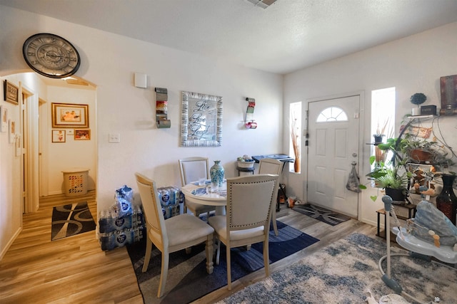 dining area with light wood-type flooring