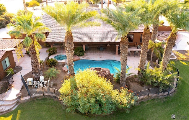 view of swimming pool with a patio and an in ground hot tub