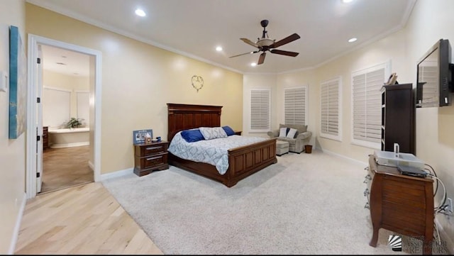 bedroom featuring connected bathroom, ceiling fan, crown molding, and light wood-type flooring