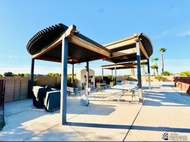 view of patio featuring ceiling fan