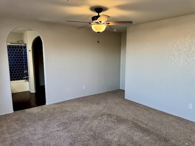 spare room with carpet floors and ceiling fan