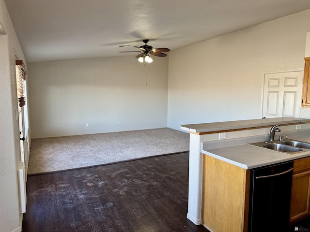 kitchen featuring dark hardwood / wood-style flooring, ceiling fan, sink, and black dishwasher