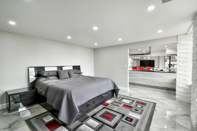 bedroom with baseboards, marble finish floor, and recessed lighting