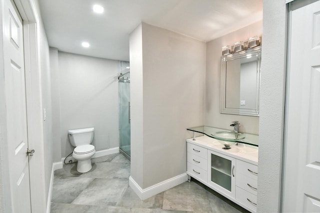 bathroom featuring tile floors, toilet, vanity, and an enclosed shower