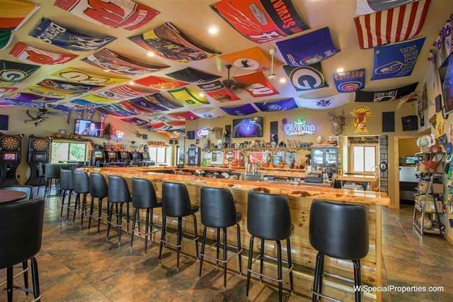 bar featuring dark tile flooring