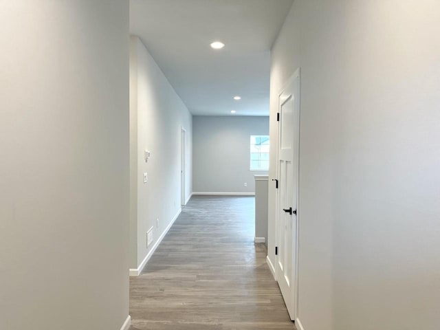 hall with light hardwood / wood-style flooring