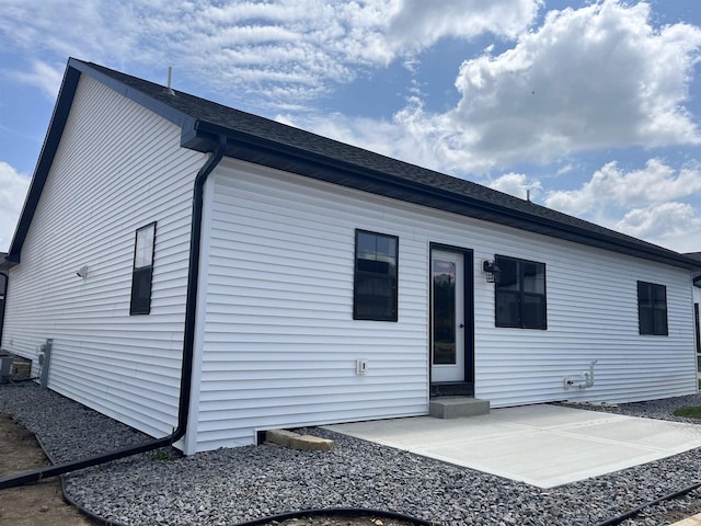 back of property featuring a patio