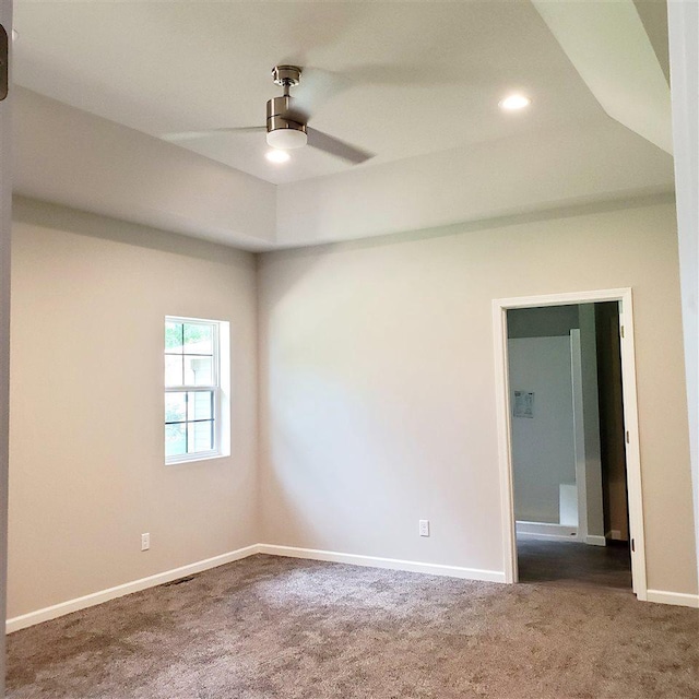 empty room with carpet floors and ceiling fan