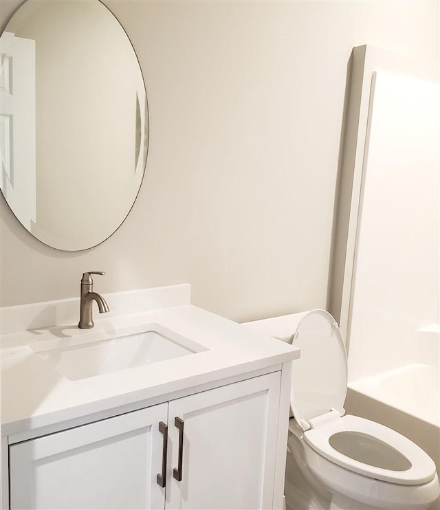 full bathroom with vanity, shower / bathing tub combination, and toilet