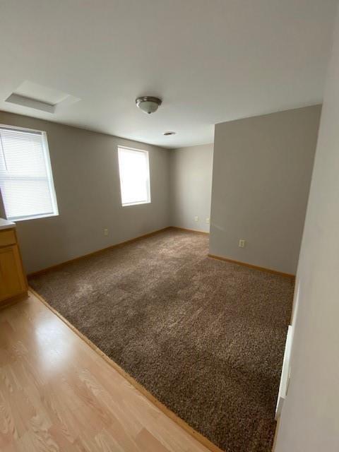 empty room with light colored carpet