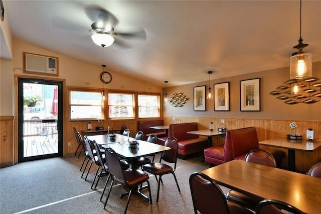 dining space with carpet flooring, vaulted ceiling, ceiling fan, and a wealth of natural light