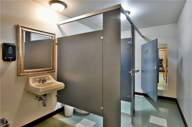 bathroom featuring sink and tile floors